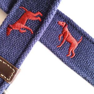 Blue fabric kids belt with embroidered dogs.